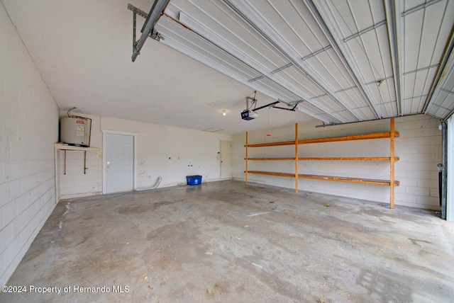 garage with a garage door opener and water heater