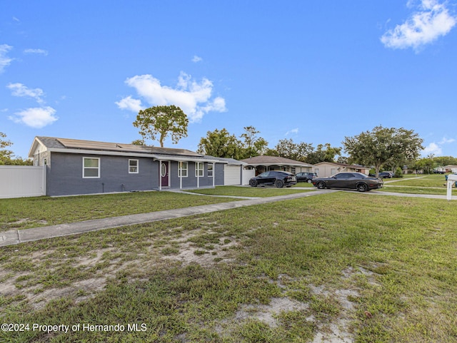 1009 Cobbelstone Dr, Spring Hill, FL 34606 - ranch-style home featuring a garage and asphalt driveway