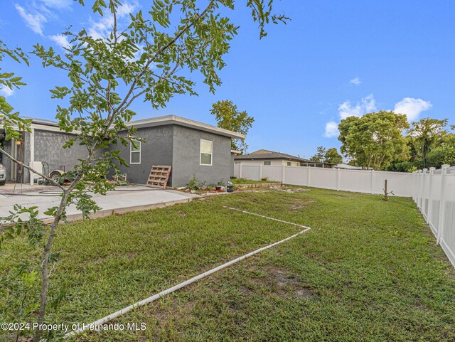 1009 Cobbelstone Dr, Spring Hill, FL 34606 - view of yard with a patio area