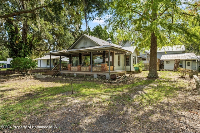 exterior space with an outbuilding and covered porch