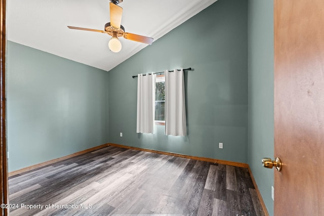 empty room with hardwood / wood-style floors, ceiling fan, and lofted ceiling