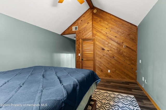 bedroom featuring vaulted ceiling with beams, wooden walls, ceiling fan, and dark wood-type flooring