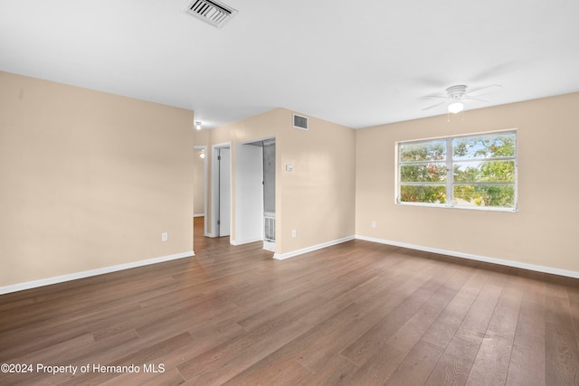 unfurnished room with hardwood / wood-style flooring and ceiling fan