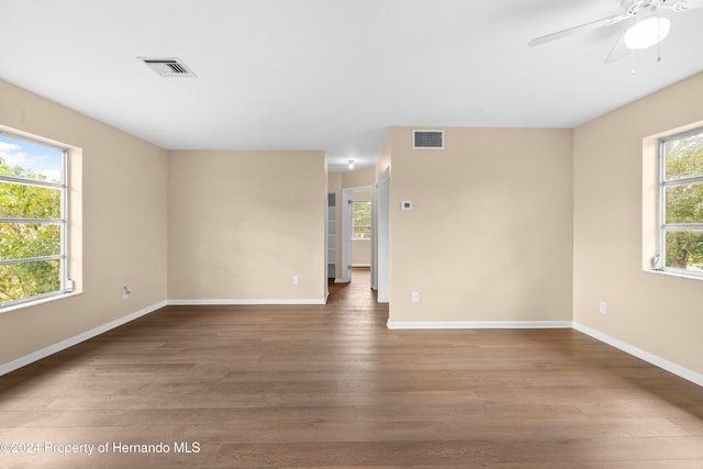 unfurnished room featuring hardwood / wood-style flooring and ceiling fan