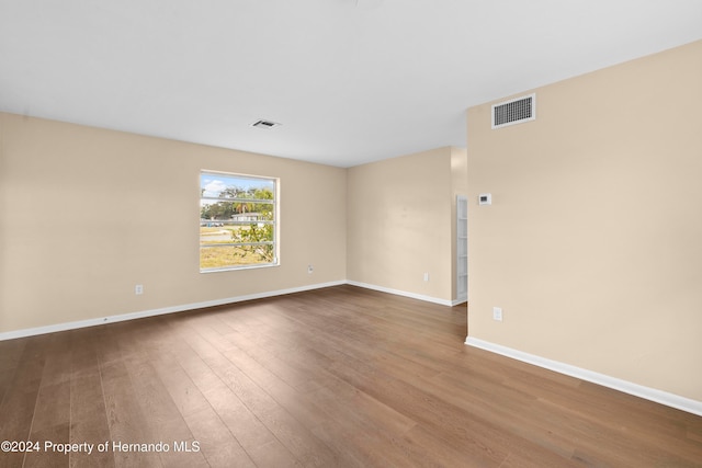 empty room featuring wood-type flooring