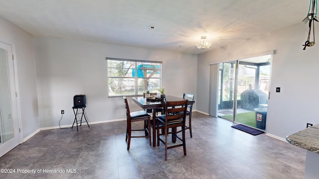 dining room featuring a notable chandelier and plenty of natural light