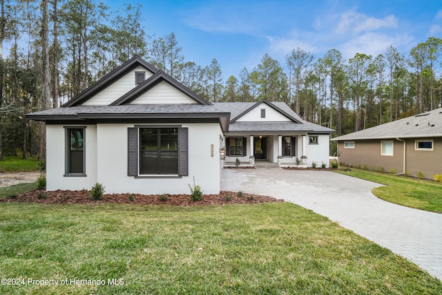 view of front of home with a front yard