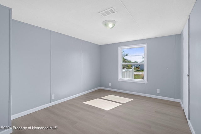 empty room with light wood-type flooring