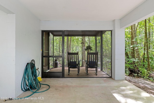 7413 Gettysburg Dr, Weeki Wachee, FL 34607 - unfurnished sunroom with plenty of natural light
