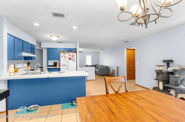 kitchen with sink, white refrigerator with ice dispenser, blue cabinets, kitchen peninsula, and light tile patterned floors