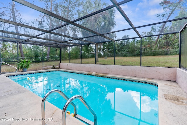 view of swimming pool with a lanai