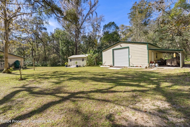 view of yard featuring a carport and a storage shed