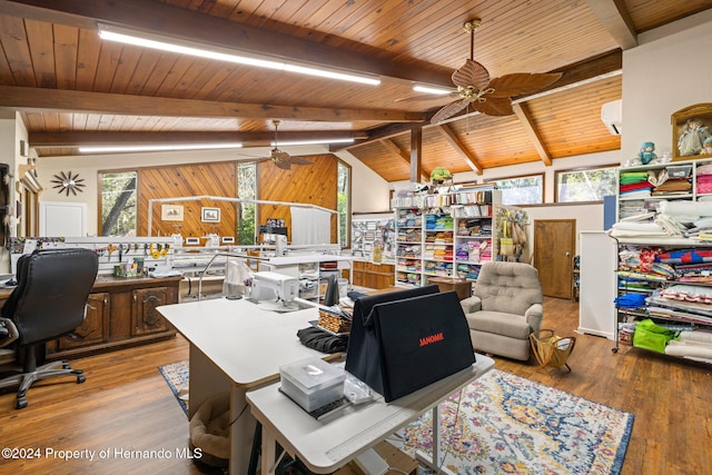 home office with vaulted ceiling with beams, ceiling fan, and light hardwood / wood-style flooring