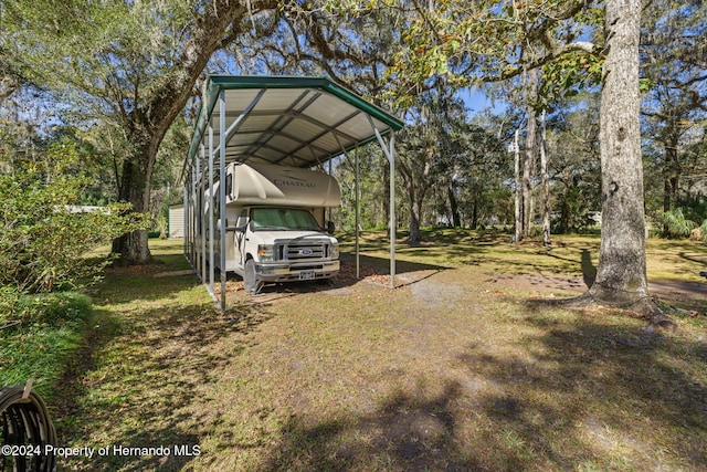 view of yard with a carport