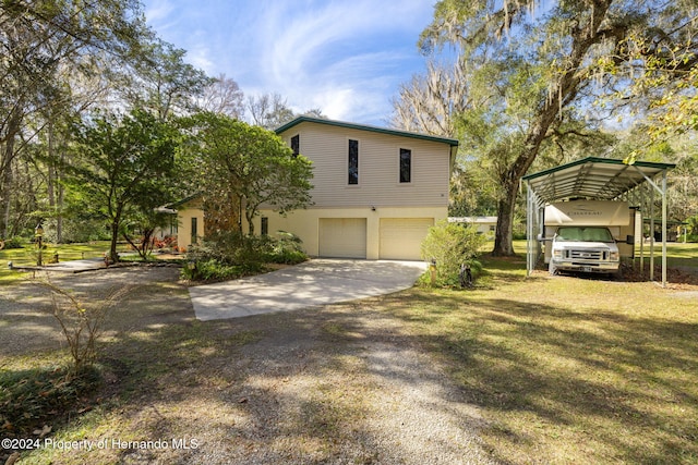 view of property exterior featuring a lawn and a garage