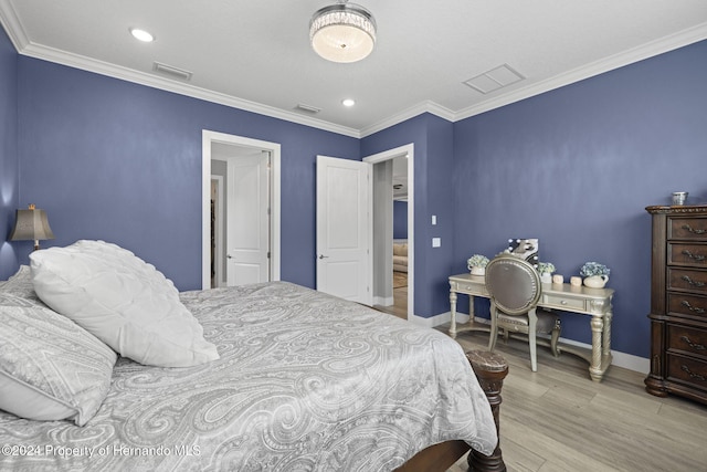 bedroom featuring crown molding and light hardwood / wood-style floors