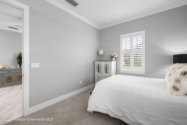 bedroom with crown molding and light carpet