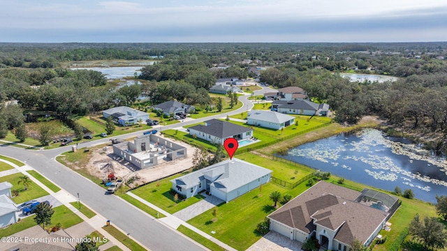 bird's eye view with a water view