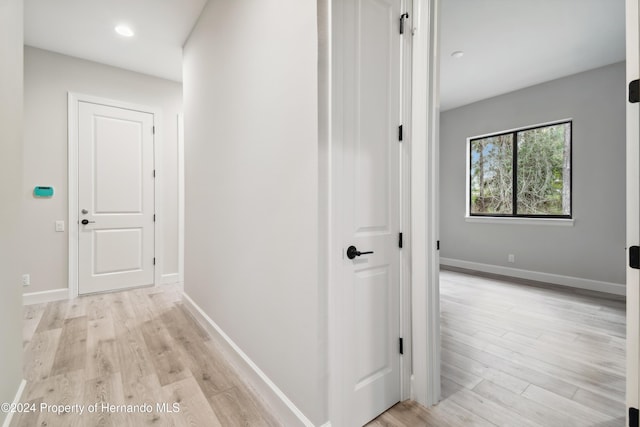 19504 Sheltered Hill Dr, Brooksville, FL 34601 - corridor with light wood finished floors, baseboards, and recessed lighting