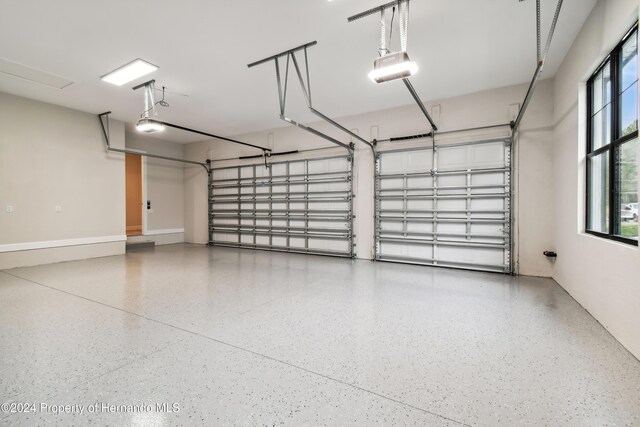 19504 Sheltered Hill Dr, Brooksville, FL 34601 - garage with a garage door opener