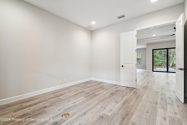19504 Sheltered Hill Dr, Brooksville, FL 34601 - empty room with light wood finished floors, recessed lighting, and baseboards