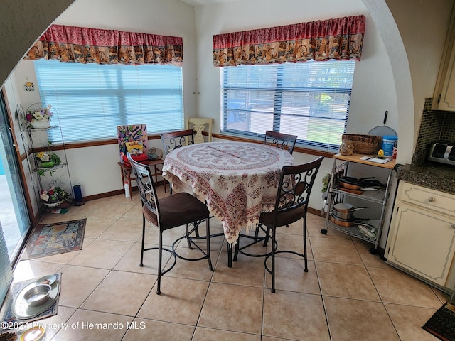 dining room with light tile patterned flooring