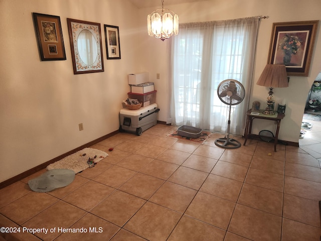 interior space with tile patterned flooring and a notable chandelier