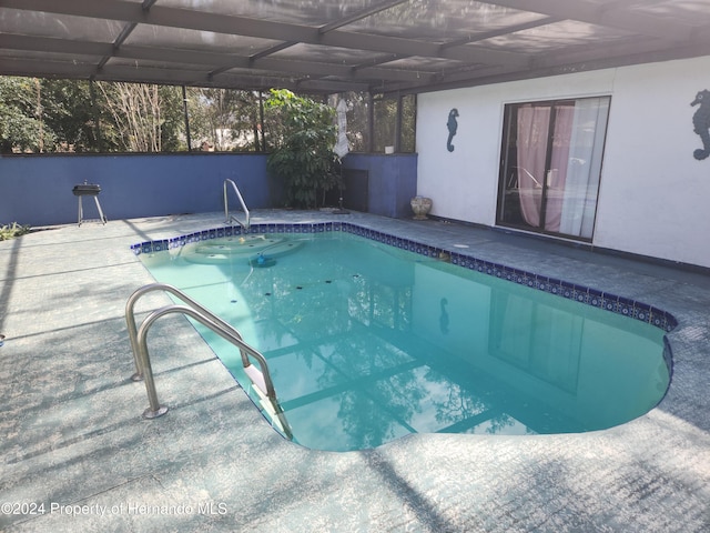 view of pool featuring a lanai and a patio area