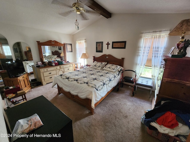 bedroom with multiple windows, ceiling fan, carpet, and lofted ceiling with beams