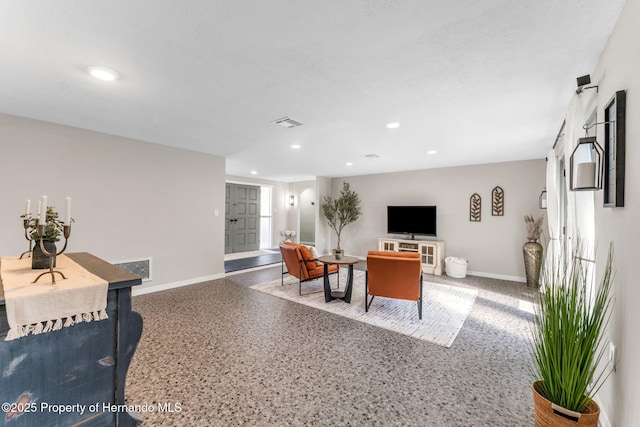 living room with a textured ceiling