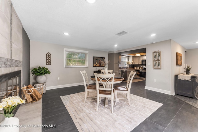 dining room with a large fireplace