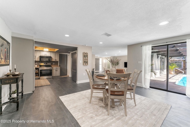 dining room featuring a textured ceiling