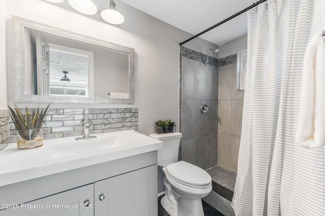 bathroom with vanity, curtained shower, backsplash, and toilet