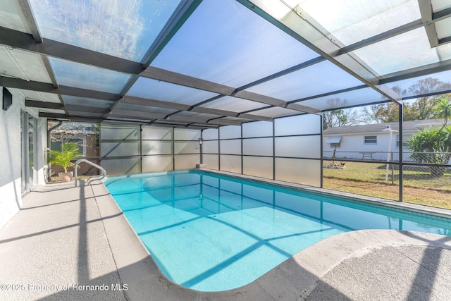 view of pool with a lanai and a patio area