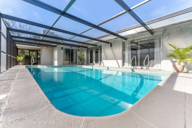 view of pool with a lanai