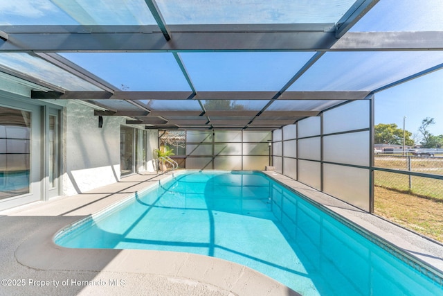 view of pool with a lanai