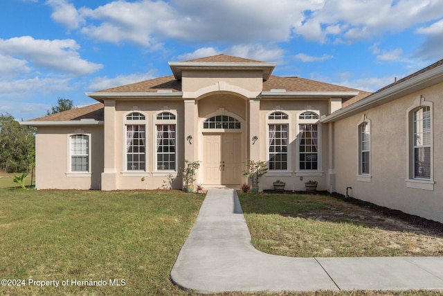 view of front of home with a front yard