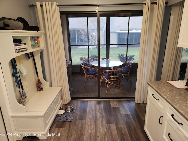 dining space featuring dark hardwood / wood-style flooring