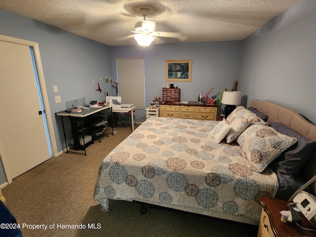 bedroom featuring light carpet, a textured ceiling, and ceiling fan