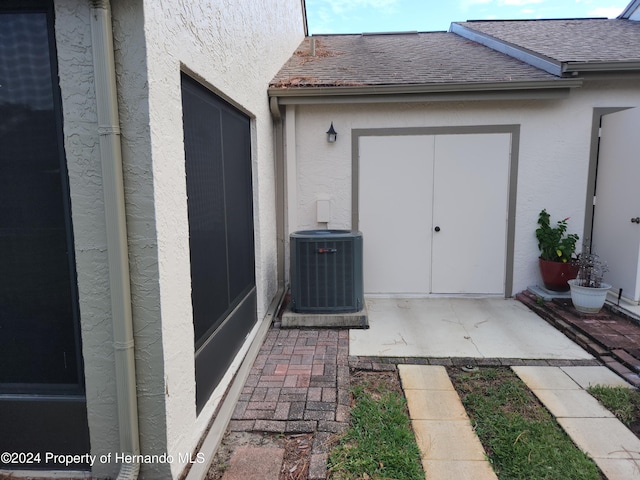 entrance to property featuring central AC unit