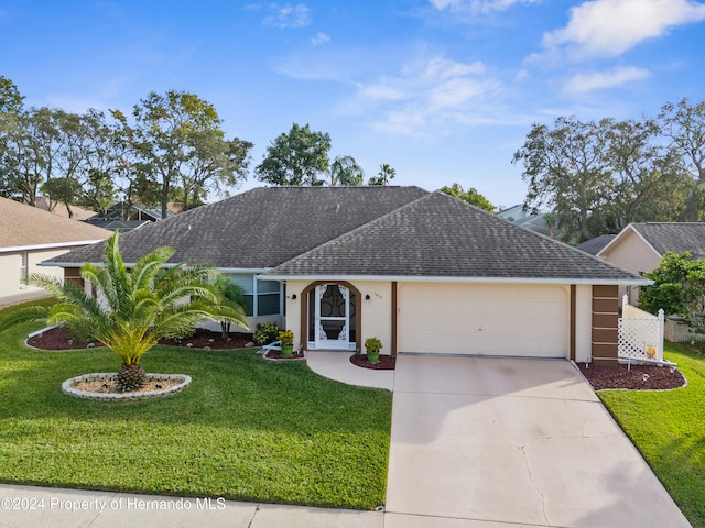 single story home featuring a front yard and a garage