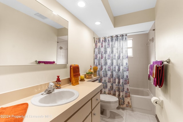 full bathroom featuring vanity, toilet, and shower / tub combo with curtain