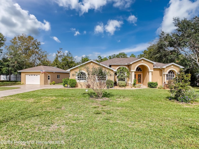 ranch-style house with a front yard and a garage