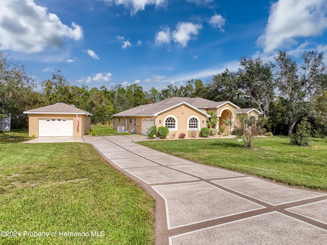 ranch-style home with a front yard and a garage