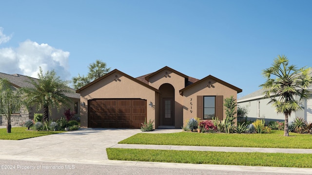 view of front of property featuring a garage and a front yard