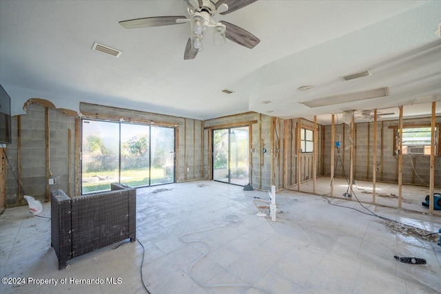 interior space featuring ceiling fan