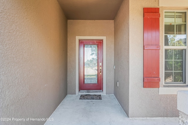 doorway to property featuring radiator heating unit