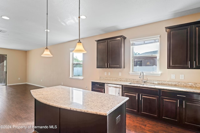 kitchen with pendant lighting, dark hardwood / wood-style floors, a healthy amount of sunlight, and sink