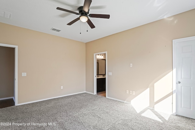 carpeted empty room featuring ceiling fan