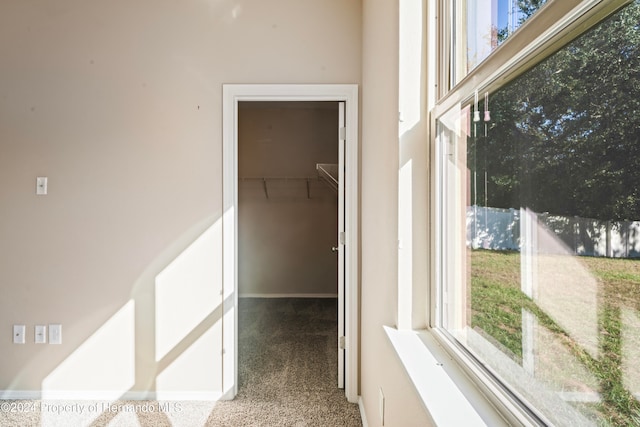 hallway featuring light carpet